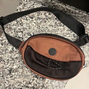 Burnt orange lululemon belt bag, small glue mark on inside,used only a few times